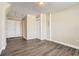 Bright bedroom features neutral walls and luxury vinyl plank flooring at 7001 Heath Dr, Port Richey, FL 34668