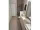 Bathroom features granite countertops, dual sinks, and a tiled walk-in shower at 1830 San Silvestro Dr, Venice, FL 34285