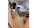 Cozy bedroom with bright walls and wood-look floors, providing a cheerful space at 1830 San Silvestro Dr, Venice, FL 34285