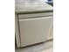 A modern white dishwasher seamlessly integrated into the kitchen cabinetry at 1830 San Silvestro Dr, Venice, FL 34285