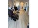 Light-filled living room featuring wood-look flooring, complementing the home's decor at 1830 San Silvestro Dr, Venice, FL 34285