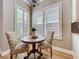 Breakfast nook features a round table, two chairs, and views of the outdoors at 4949 Sandy Glen Way, Wimauma, FL 33598