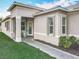 Inviting front entrance with a tiled walkway and charming curb appeal at 4949 Sandy Glen Way, Wimauma, FL 33598