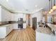 Spacious kitchen featuring granite countertops, stainless steel appliances, and an open layout at 4949 Sandy Glen Way, Wimauma, FL 33598