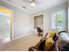 Office space with a built-in desk, chair, and natural light at 4949 Sandy Glen Way, Wimauma, FL 33598