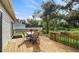 Inviting deck perfect for entertaining, with a table, chairs, and flower boxes overlooking the yard at 5658 Babroff Ter, North Port, FL 34291