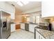 Well-equipped kitchen featuring stainless steel appliances and granite countertops at 8147 Matthew Dr, New Port Richey, FL 34653