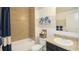 Well-lit bathroom featuring a tub/shower combo and neutral color scheme at 150 Castile Ct, Punta Gorda, FL 33983
