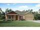 Inviting single-story home with manicured lawn and colorful flowerbeds at 150 Castile Ct, Punta Gorda, FL 33983