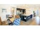 Open-concept kitchen with stainless steel appliances and granite island at 150 Castile Ct, Punta Gorda, FL 33983