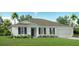 Charming single-story home with a two-car garage, lush lawn, and a welcoming front entrance at 469 Chubut Ct, Punta Gorda, FL 33983