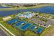 Aerial view of community amenities including pool, tennis courts, and clubhouse at 5013 Sea Branch Ave, Apollo Beach, FL 33572