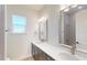 Bright bathroom featuring double vanity with elegant white countertops and modern fixtures at 5013 Sea Branch Ave, Apollo Beach, FL 33572