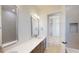 Bright bathroom with double vanity, white countertops, and modern finishes throughout at 5013 Sea Branch Ave, Apollo Beach, FL 33572