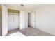 Bright bedroom with plush carpeting and a spacious closet with shelving at 5013 Sea Branch Ave, Apollo Beach, FL 33572