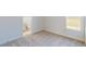 Cozy bedroom with neutral carpeting and a view of the outdoors at 5013 Sea Branch Ave, Apollo Beach, FL 33572