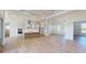 Open-concept kitchen and living area with stainless steel appliances and a center island at 5013 Sea Branch Ave, Apollo Beach, FL 33572