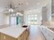 Modern kitchen with quartz countertops, stainless steel appliances, and a large kitchen island at 5013 Sea Branch Ave, Apollo Beach, FL 33572