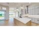 Spacious kitchen with a large island, quartz countertops, and stainless steel appliances at 5013 Sea Branch Ave, Apollo Beach, FL 33572