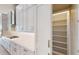 Modern kitchen featuring sleek cabinetry, stainless steel appliances, and a large pantry for ample storage at 5013 Sea Branch Ave, Apollo Beach, FL 33572