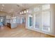 Open-concept living area with kitchen, large windows, and hardwood flooring at 5013 Sea Branch Ave, Apollo Beach, FL 33572