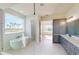 Bright bathroom with double vanities, soaking tub, and a glass shower at 5013 Sea Branch Ave, Apollo Beach, FL 33572