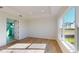 Bedroom with tray ceiling, large windows and view at 5013 Sea Branch Ave, Apollo Beach, FL 33572