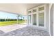 Covered patio with brick flooring, offering a relaxing outdoor space at 5013 Sea Branch Ave, Apollo Beach, FL 33572