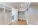 Large walk-in closet with custom shelving and adjacent bathroom at 5013 Sea Branch Ave, Apollo Beach, FL 33572