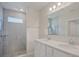 Well-appointed bathroom featuring double vanity, walk-in shower with tile surround, and modern fixtures at 25880 Prada Dr, Punta Gorda, FL 33955