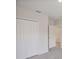 Bedroom with neutral carpet, white doors and walls at 25880 Prada Dr, Punta Gorda, FL 33955
