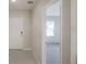 Entryway with large gray tiles and a white front door at 25880 Prada Dr, Punta Gorda, FL 33955