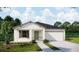 Charming single-story home featuring a two-car garage and well-maintained landscaping at 25880 Prada Dr, Punta Gorda, FL 33955