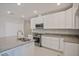 Well-equipped kitchen featuring granite countertops, stainless appliances, and ample storage at 25880 Prada Dr, Punta Gorda, FL 33955