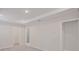 Spacious main bedroom featuring tray ceilings, plush carpeting and ensuite bathroom at 25880 Prada Dr, Punta Gorda, FL 33955