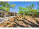 Spacious backyard with mature trees providing shade and privacy at 3201 Cord St, Tampa, FL 33605