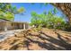 Spacious backyard with mature trees providing shade and privacy at 3201 Cord St, Tampa, FL 33605