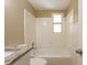 Bright bathroom features a tub and shower combination with tiled walls and granite topped vanity at 3201 Cord St, Tampa, FL 33605