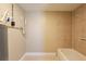 Tiled bathroom with neutral walls and fixtures, and a tiled tub at 3201 Cord St, Tampa, FL 33605