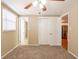 Neutral bedroom featuring carpeted flooring, a ceiling fan, and two closets for ample storage at 3201 Cord St, Tampa, FL 33605