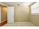 This bedroom features neutral walls, tile flooring, and a window with blinds for natural light at 3201 Cord St, Tampa, FL 33605
