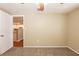 Neutral bedroom featuring carpeted flooring with view of kitchen at 3201 Cord St, Tampa, FL 33605