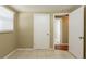 This bedroom features neutral walls, tile flooring, and a window with blinds for natural light at 3201 Cord St, Tampa, FL 33605