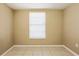 This bedroom features neutral walls, tile flooring, and a window with blinds for natural light at 3201 Cord St, Tampa, FL 33605