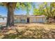 Charming single-story home with brick facade, a well-manicured lawn, and mature shade trees in a quiet neighborhood at 3201 Cord St, Tampa, FL 33605