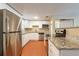Bright kitchen featuring stainless steel appliances, granite countertops, and white cabinets at 3201 Cord St, Tampa, FL 33605