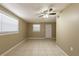 An open living room featuring neutral tile and bright natural light at 3201 Cord St, Tampa, FL 33605