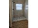 Beautiful bathroom shower with sleek, marble-like tile and modern fixtures at 17065 Malta Ave Ave, Port Charlotte, FL 33954