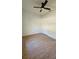 Comfortable bedroom featuring hardwood floors, a ceiling fan, and a closet at 17065 Malta Ave Ave, Port Charlotte, FL 33954