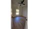 Well-lit bedroom featuring hardwood floors, a ceiling fan, and natural light from the window at 17065 Malta Ave Ave, Port Charlotte, FL 33954